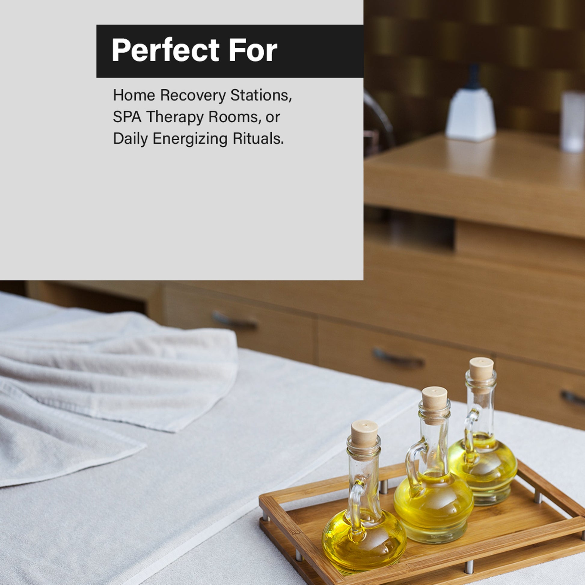 A promotional graphic with a light gray text panel reading 'Perfect For: Home Recovery Stations, SPA Therapy Rooms, or Daily Energizing Rituals.' over a spa scene showing a massage table with white linens and three small glass oil bottles on a wooden tray in a warm wood-toned room.
